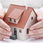 hands-around-a-model-house