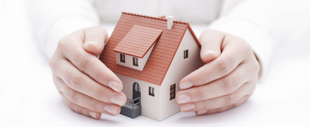 hands-around-a-model-house